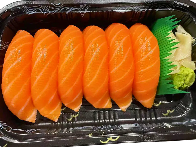 Fresh salmon nigiri served with wasabi and pickled ginger at Sake Mian, a Japanese Restaurant in Ardmore